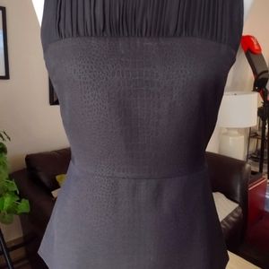 Cabi sleeveless peplum black top size 2